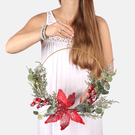 Snow-covered ring with poinsettia